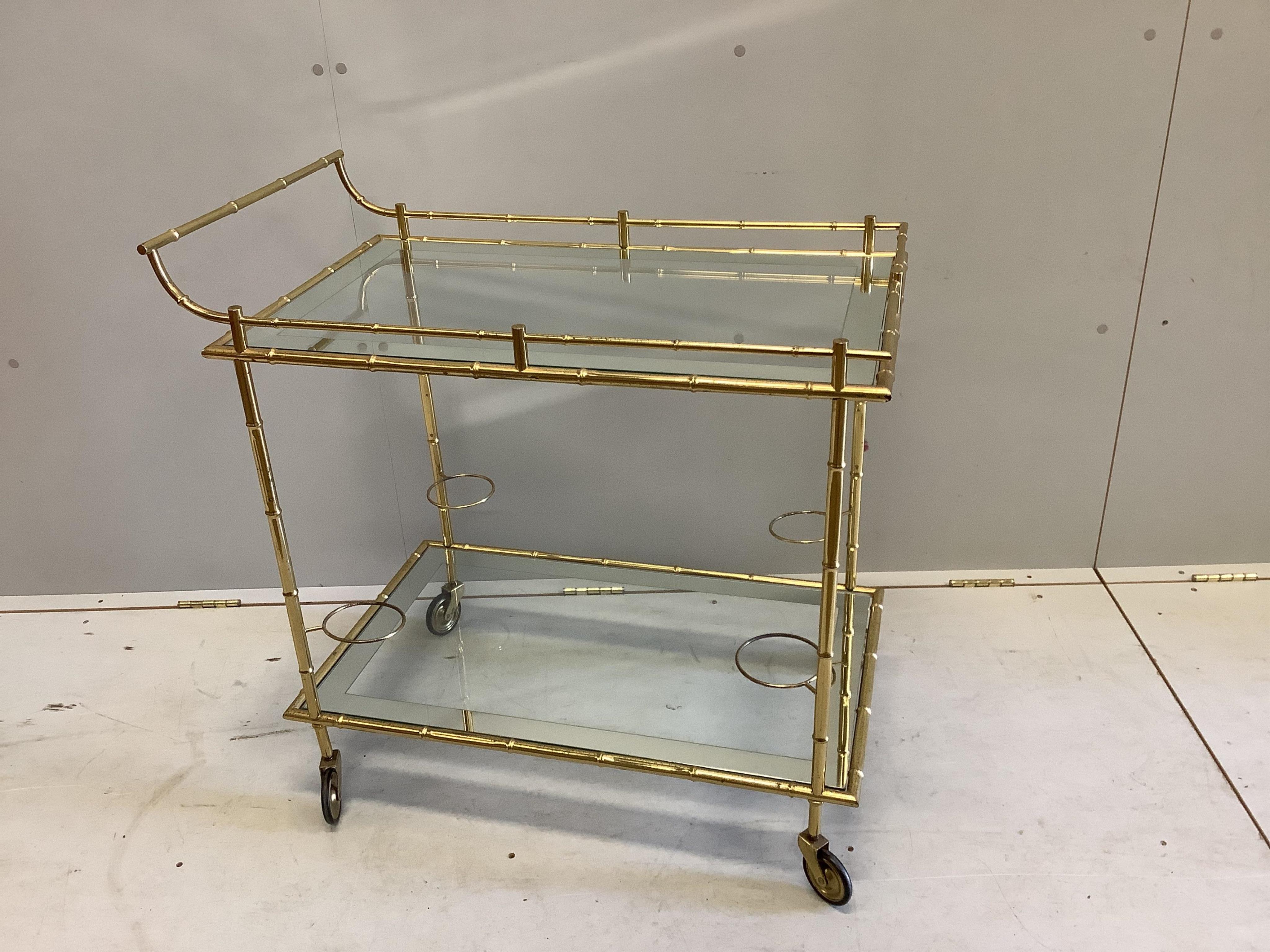 A Maison Jansen style gilt brass and glass drinks trolley, width 80cm, height 80cm. Condition - fair